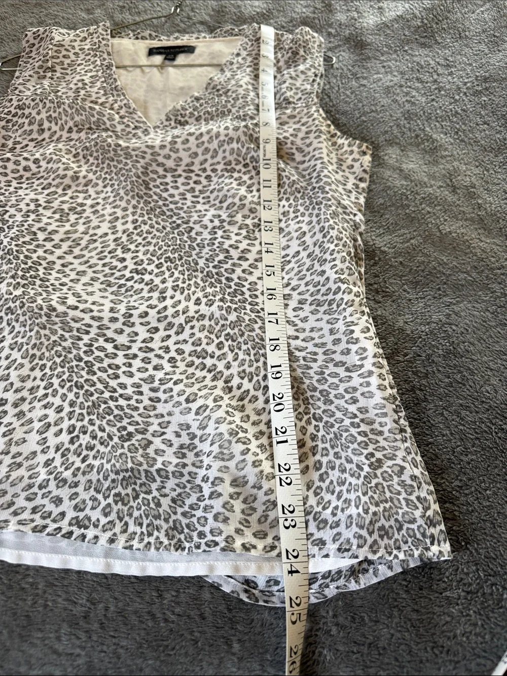 Two Banana Republic sleeveless blouses.